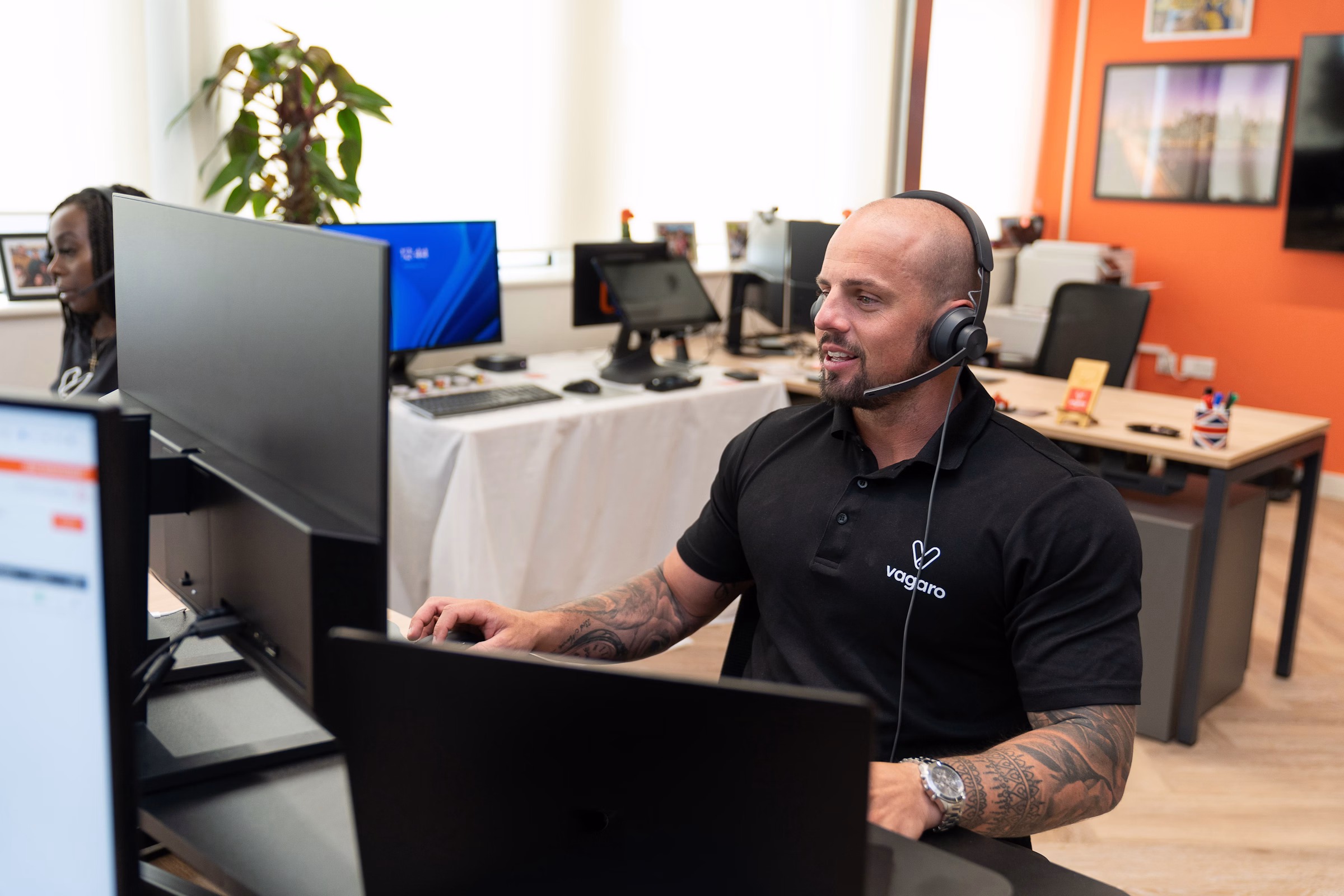 Customer support professional using software representing CRM service workflows