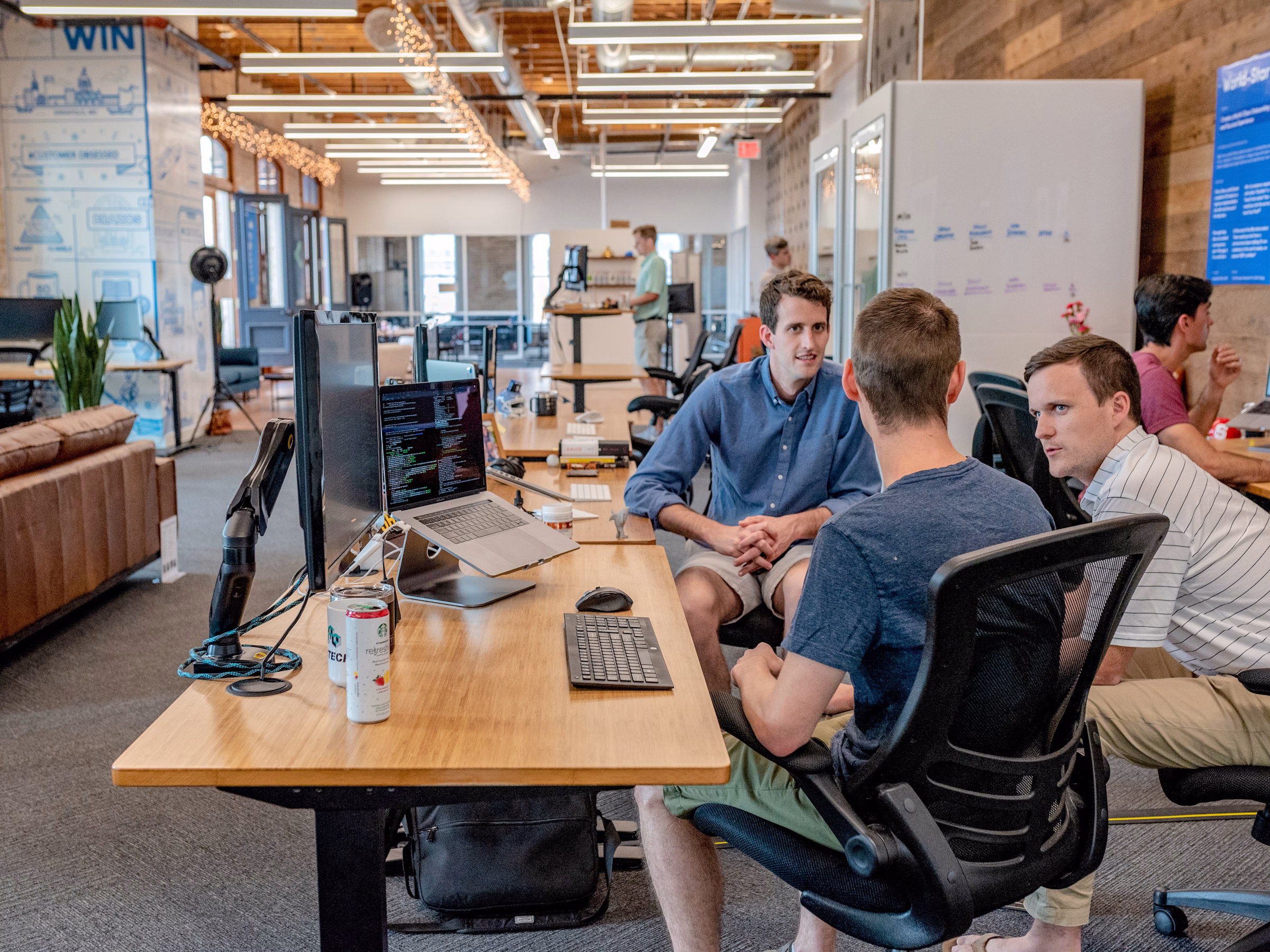 Business team collaborating around CRM and ERP workflow design
